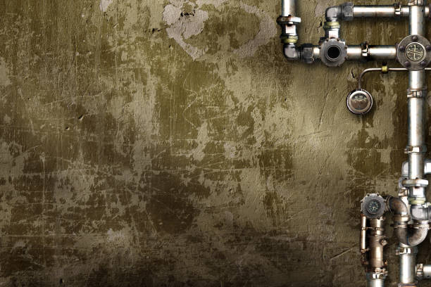 istock Vintage steampunk backdrop with pipes on stucco wall. Open space with concrete wall and retro pipelines. Mock-up template. Grunge interior background. Copy space for text 2193295371