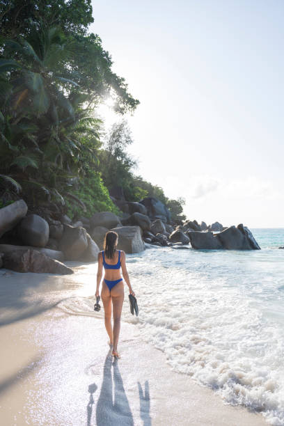 istock Young woman prepares to go snorkelling 2193295435