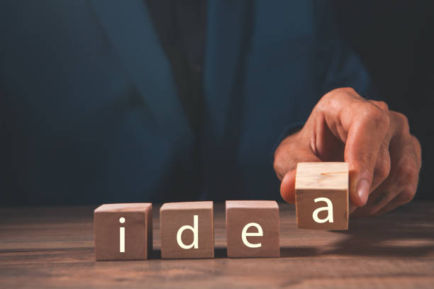 istock businessman holding letter block word 2193295913