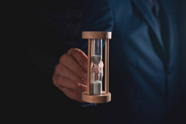 istock businessman with hourglass in hand 2193295957
