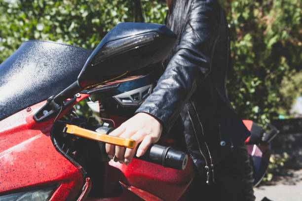 istock biker woman in a black jacket with a motorcycle 2193301532