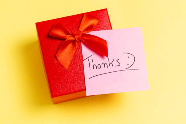 istock A red box with a red ribbon and a pink note that says 