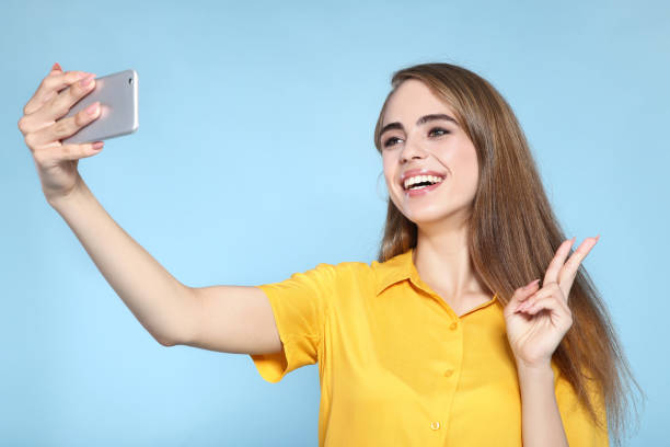 istock Young beautiful girl making selfie on smartphone 2193303204