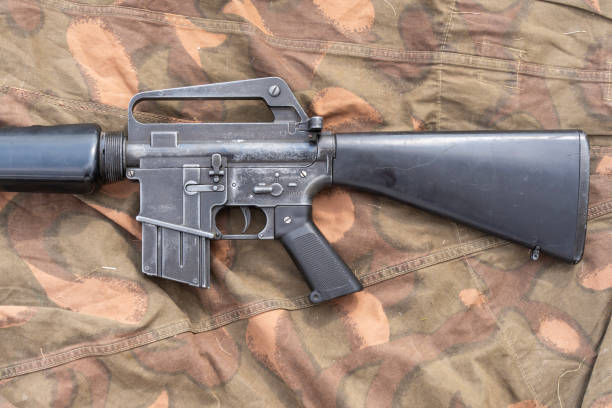 istock Old American made M16 rifle on a camouflage tarp 2193306442