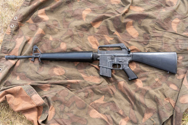 istock Old American made M16 rifle on a camouflage tarp 2193306448