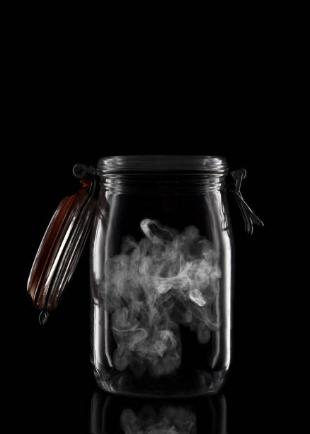 istock A glass storage or canning jar isolated on black with reflection, with lid open. 2193308205