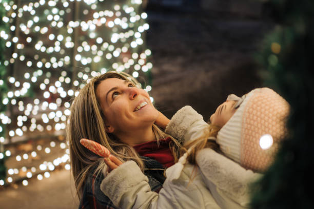 Mother and Daughter Admiring Christmas Lights