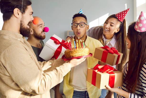 istock Smiling multiracial friends greeting mate with happy birthday 2193308969
