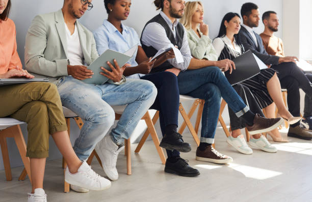 istock Diverse employees in row wait for company interview 2193309585