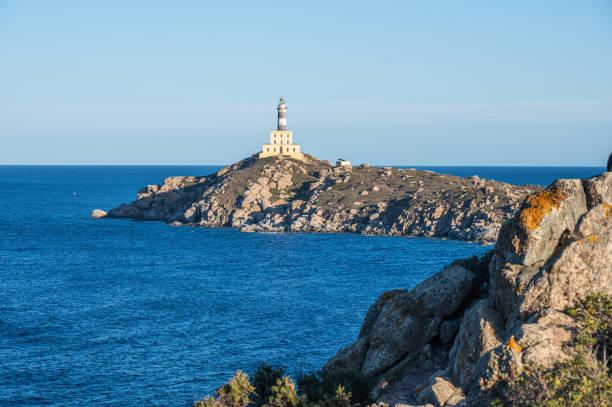 istock The lighthouse overlooking the cliffs of Isola dei Cavoli in Villasimius 2193309630