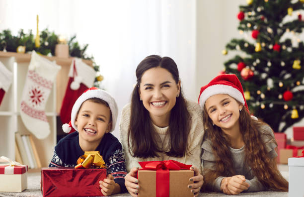 istock Smiling mother and kids celebrate New Year together 2193310941