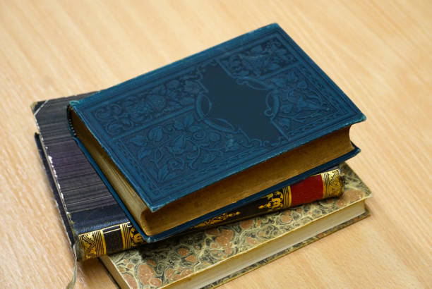 istock Various antique books on the table with beautiful decorated book covers 2193311763