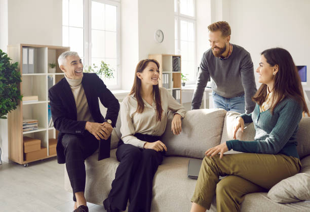 istock Smiling diverse employees discuss ideas in cozy office 2193320127