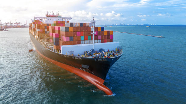 istock Aerial side view of cargo ship carrying container and running for export cargo yard port to custom ocean concept technology transportation , customs clearance, webinar banner forwarder mast 2193322943