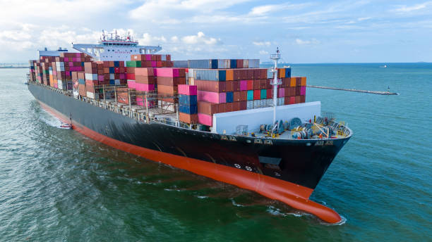 istock Aerial side view of cargo ship carrying container and running for export cargo yard port to custom ocean concept technology transportation , customs clearance, webinar banner forwarder mast 2193323519