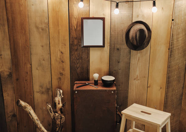 istock Shaving tools on an old suitcase in front of a wooden wall. 2193323721