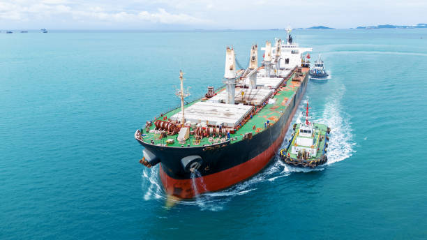 istock Cargo Ship was pulling by Tugboat go to Maintenance port. cargo ship import export to customers sea port. export shipping industry freight and transportation logistics concept 2193323843
