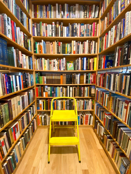 istock Stool in front of bookshelves inside bookstore 2193324181