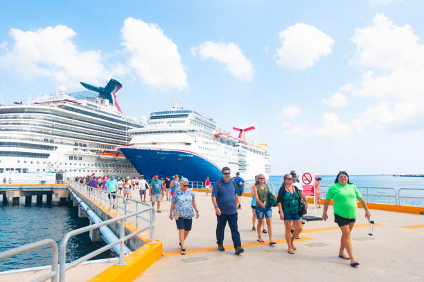 Passengers of the Carnival cruise line disembark  of the ships Jubilee and Paradise for an excursion at the Costa Maya Cruise Port, Mexico.