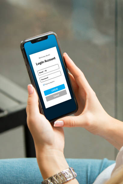 istock Woman Looking at Mobile App Login Screen 2193329354