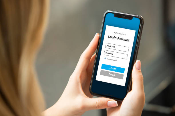 istock Woman Looking at Mobile App Login Screen 2193329359