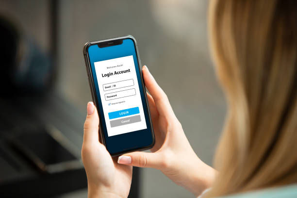 istock Woman Looking at Mobile App Login Screen 2193329363