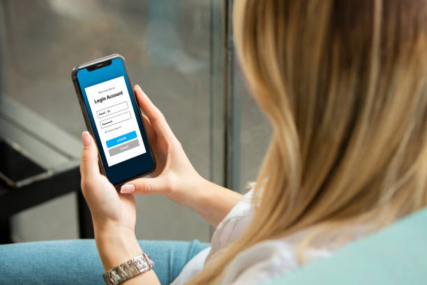 istock Woman Looking at Mobile App Login Screen 2193329364
