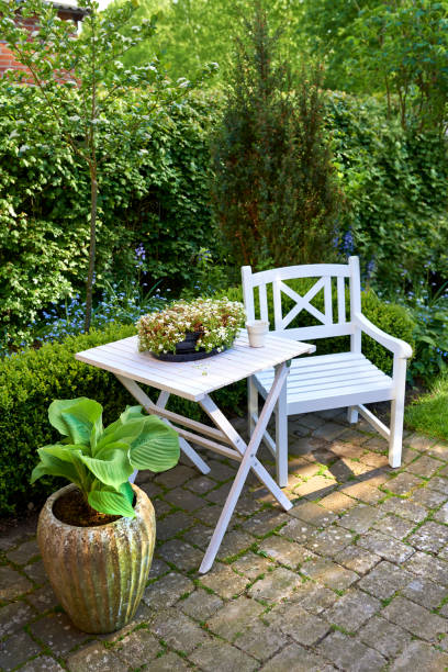 istock Serene garden seating setup with lush greenery in a Mediterranean style - Spain, Majorca 2193331286