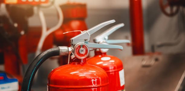 istock Engineer checks fire extinguisher in fire control room to ensure safety. When an emergency occurs 2193338863