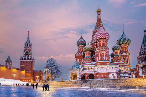 istock Saint Basil's Cathedral and Spasskaya Tower in Snowy Red Square at Dusk. 2193341759