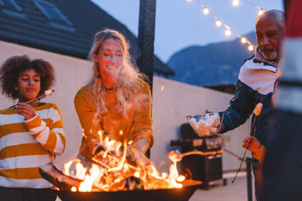 istock Diverse Family Enjoying Backyard Camping with Roasting Marshmallows 2193341890
