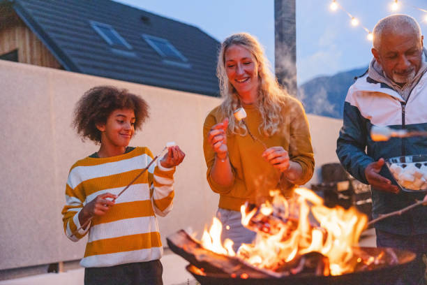 istock Multigenerational Diverse Family Enjoying Marshmallow Roasting on Camping Trip 2193341895