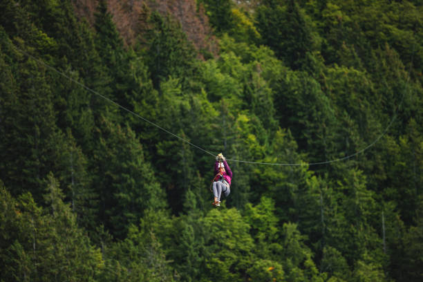 istock Indian Female Enjoying Zipline Adventure in Forest 2193341930
