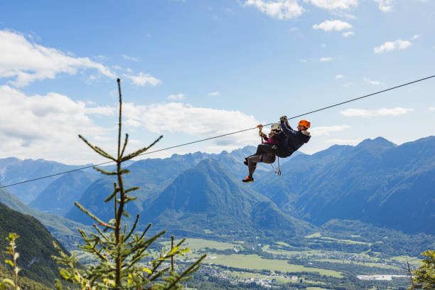 istock Diverse Group Enjoying Zip Line Adventure in Mountain Landscape 2193341948