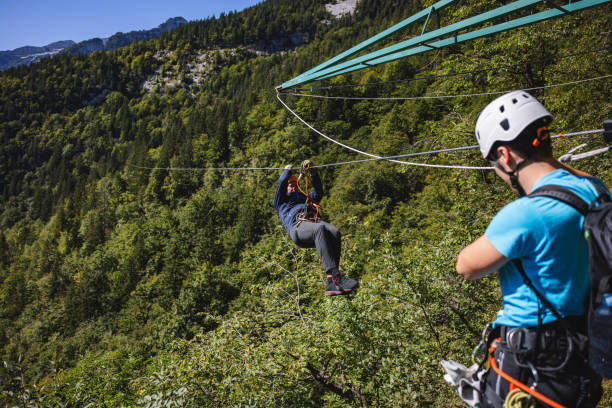 istock Person Enjoying Zip Line Adventure Above Forest 2193342049