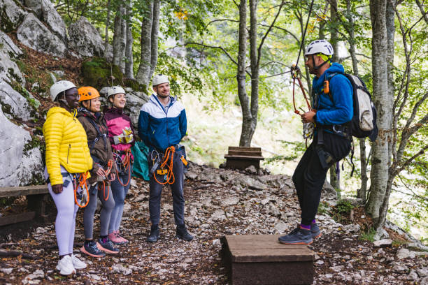 istock Zipline Instructor Briefing Diverse Participants in Forest 2193342057