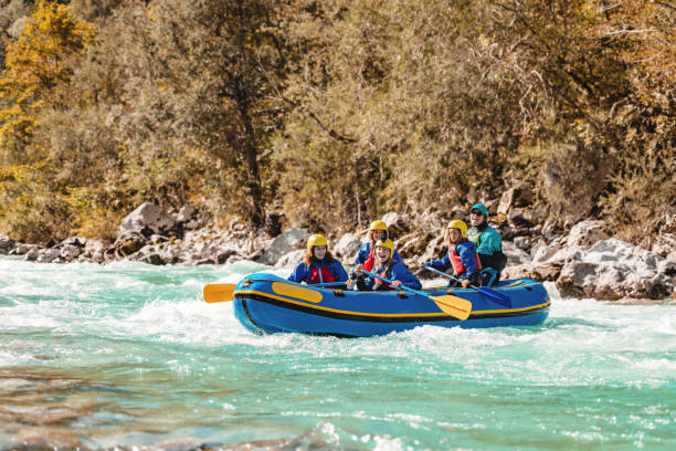 istock Family Enjoying Whitewater Rafting Adventure with Guide 2193342095