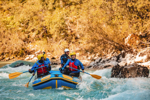 istock Group of Friends Enjoying Whitewater Rafting Adventure 2193342105