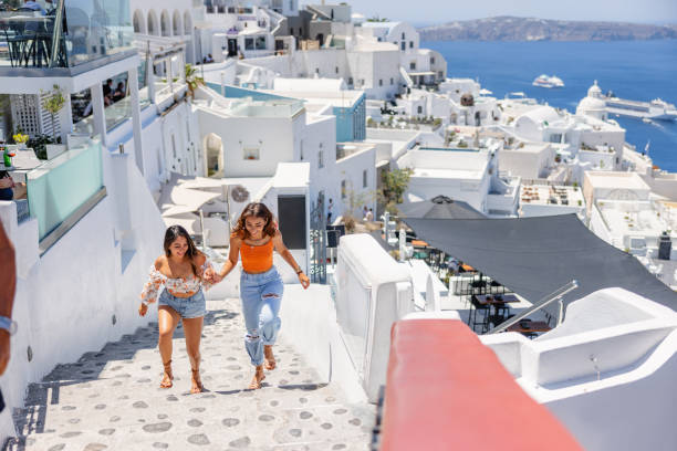 istock Joyful Young Women Exploring Santorini 2193342217