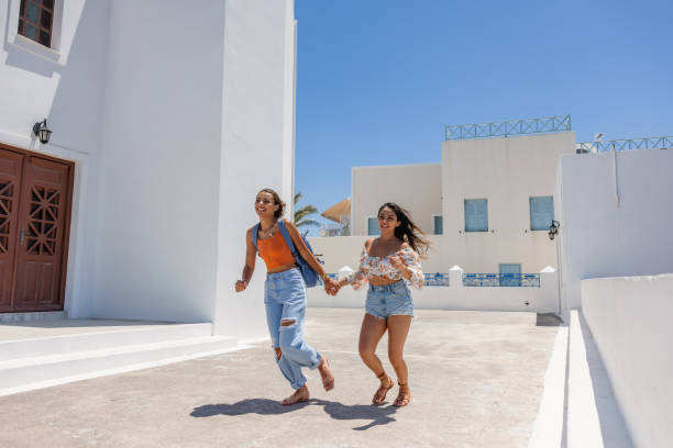 istock Joyful Young Women Exploring Santorini 2193342248