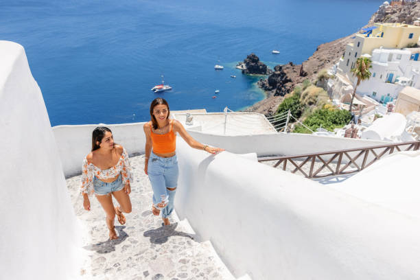 istock Young Women Exploring Oia Village in Santorini 2193342252