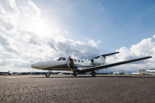 istock Luxury Small Private Jet on Airport Runway Under Sunny Sky 2193342277