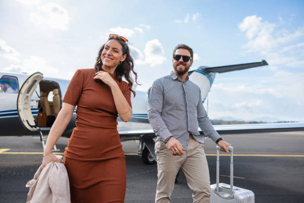 Affluent Couple Walking on Tarmac After Exiting Private Jet