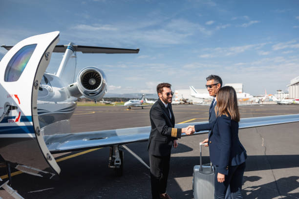 istock Pilot Greeting Executives at Private Jet Before Departure 2193342286