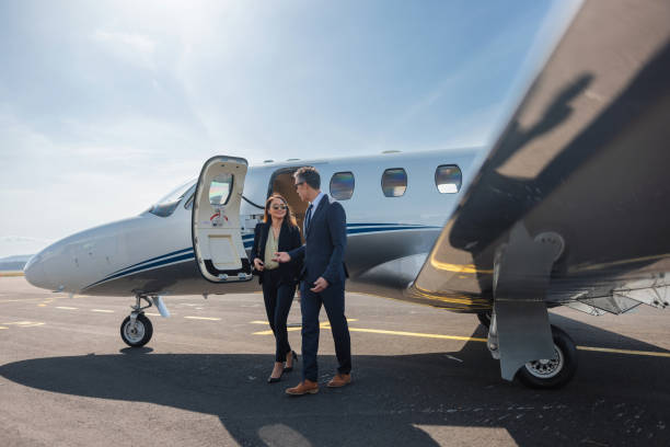 istock Business Professionals Walking From Private Jet 2193342289