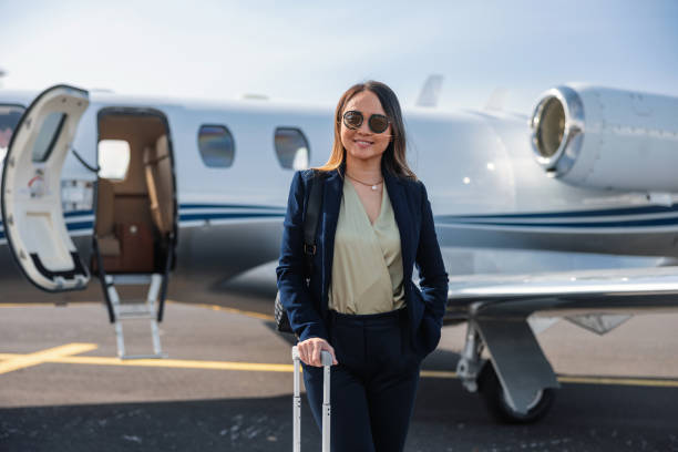 istock Confident Businesswoman With Private Jet 2193342295