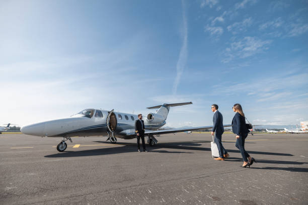 istock Business Executives Boarding Private Jet for Travel 2193342297