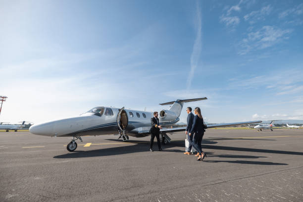 istock Business Executives Boarding a Private Jet for Travel 2193342299
