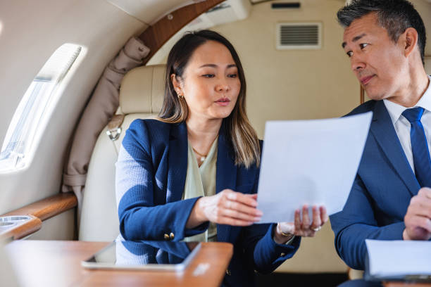 istock Asian Business Executives Working in Private Jet 2193342309