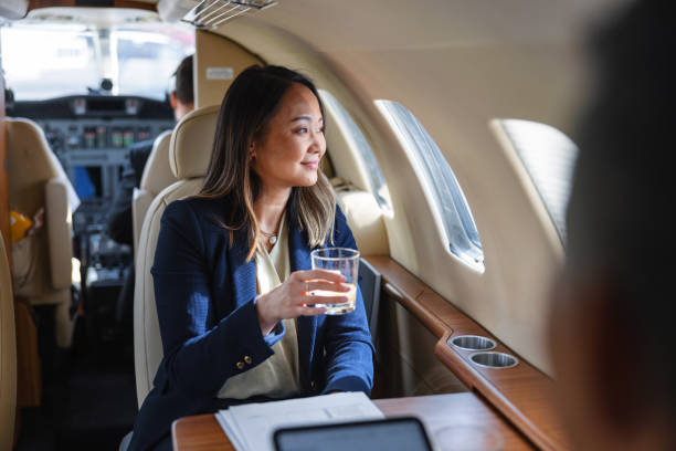 istock Business Executive Enjoying Whiskey on a Private Jet 2193342323
